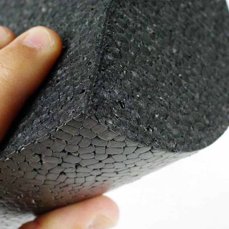 Semi-circular yoga foam roller in black, 30cm length, for muscle massage and stretching