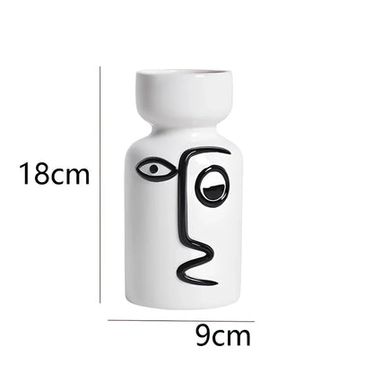 Ceramic vase with hand-painted surface in modern minimalist design, shown in large and small size variations