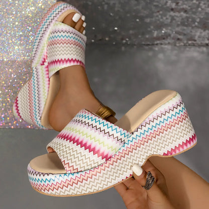Women's beige wedge sandals with a blue wave print, thick rubber sole, and open fish mouth toe.