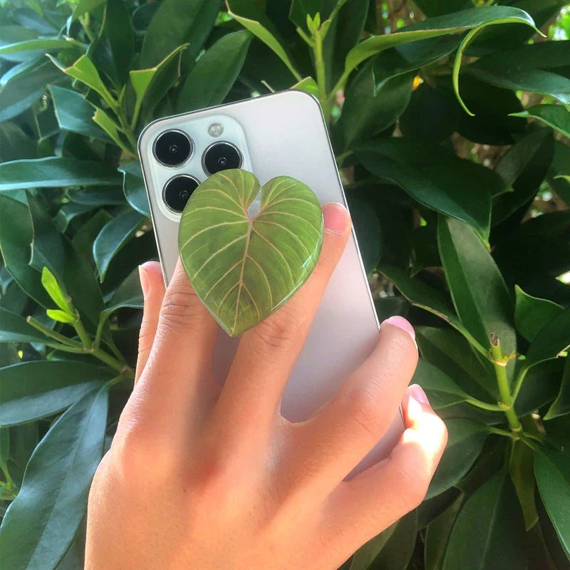 Stylish leaf-inspired smartphone stand with secure grip and adjustable viewing angle for hands-free use