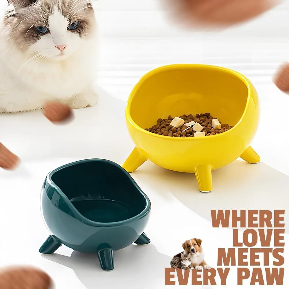 Green ceramic cat food bowl with four legs and elevated design for stable feeding