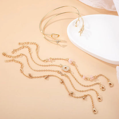 Set of six gold-colour zinc alloy bracelets with water drop, arrow, and V-shaped charms.