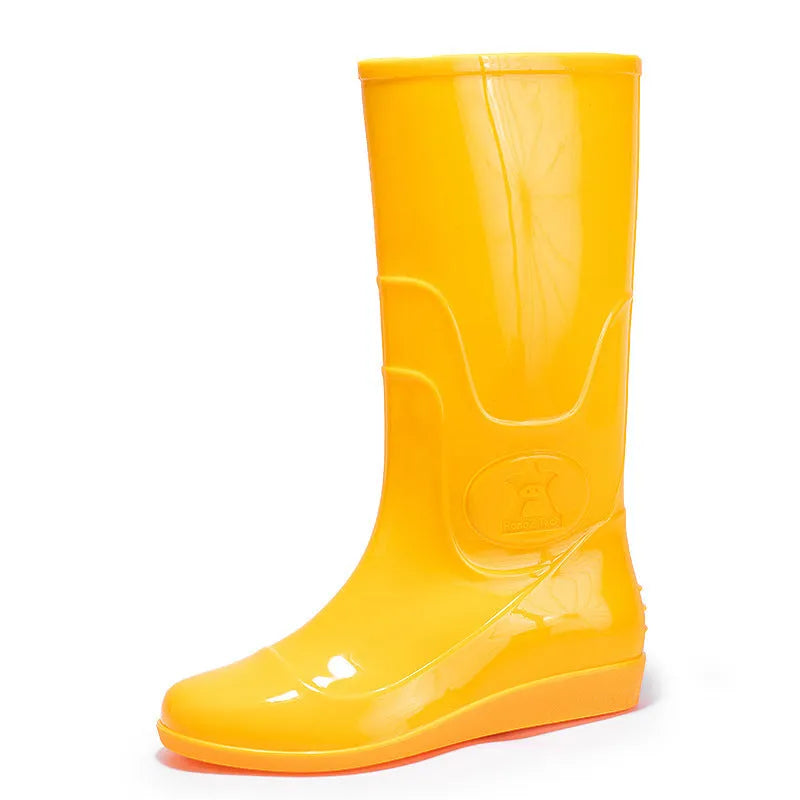 Men's white and yellow flat plastic rain boots with high tube design on a neutral background.