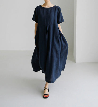 Comfortable cotton linen round neck dress in navy blue, army green, and apricot colors, perfect for casual wear.