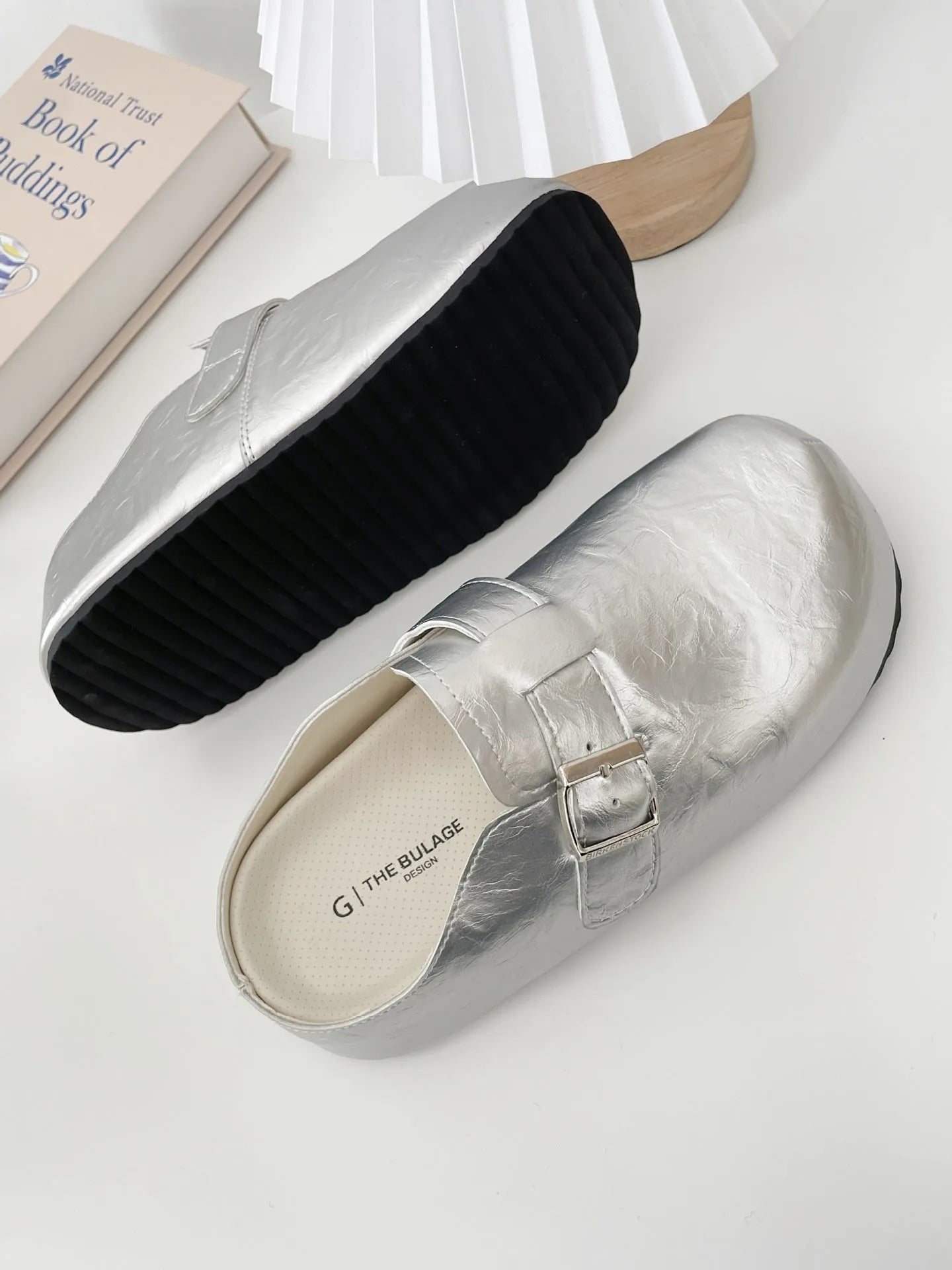 Flat buckle casual sneakers in beige, black, silver, and yellow colours, showing round toe and PU upper.