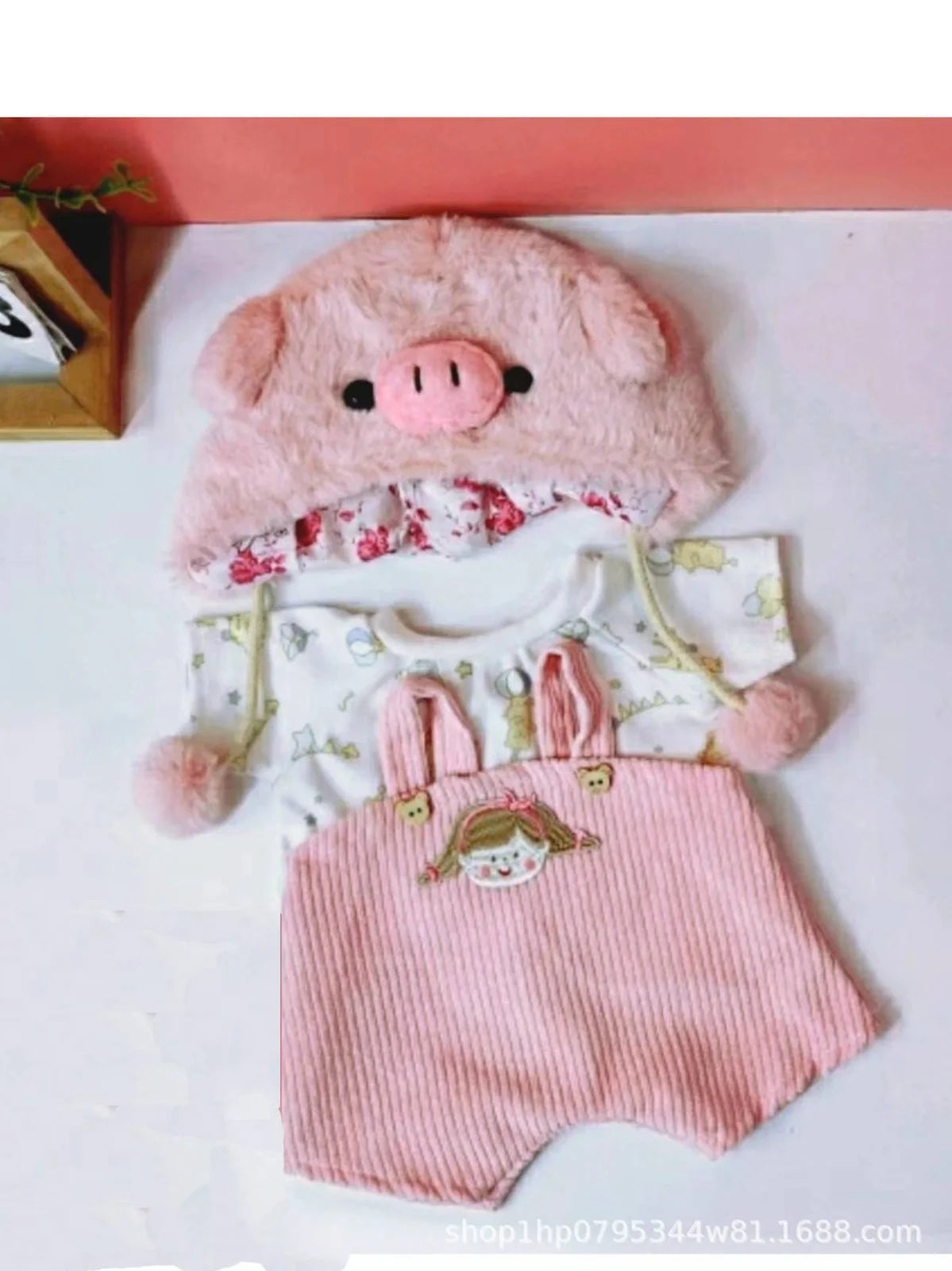 30cm doll clothing collection showing multiple outfit pieces including hooded jackets, sweaters, and suspender pants