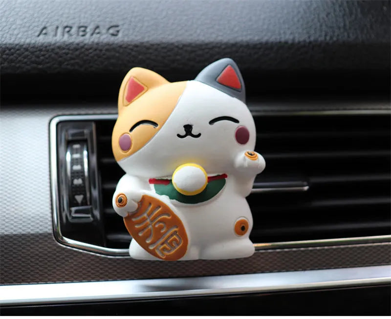 Resin cat-shaped car vent clip holding aromatherapy cotton for vehicle odour control