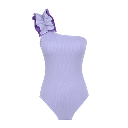 A woman's solid colour one-piece swimsuit with a single-shoulder suspender tube top design.
