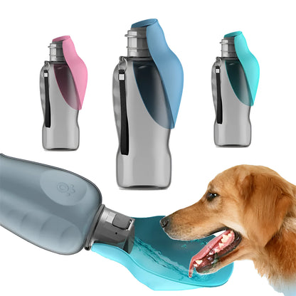 Blue grey portable dog water bottle with foldable drinking bowl and wrist strap, shown next to a dog.