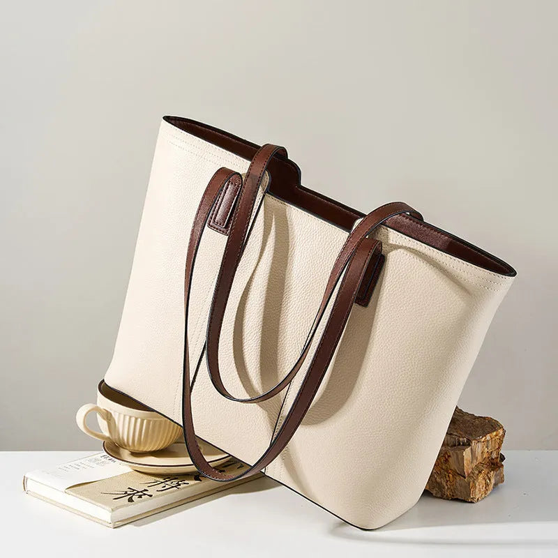 Women's genuine leather large capacity crossbody commuter bag in black, shown with internal organised compartments.
