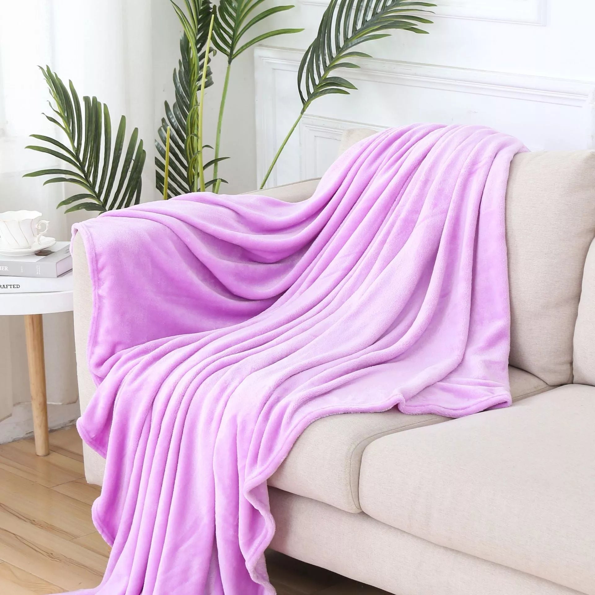 Solid color flannel blanket in various sizes and colors, made from durable polyester fiber