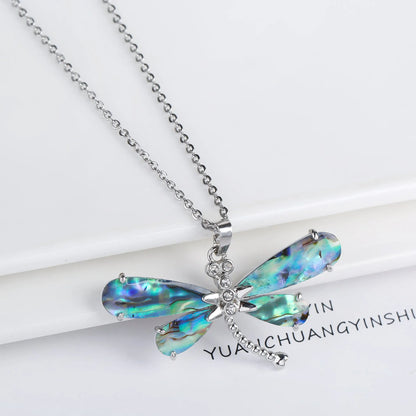 Abalone shell pendant necklace with copper electroplated animal zodiac design and butterfly or dragonfly detail
