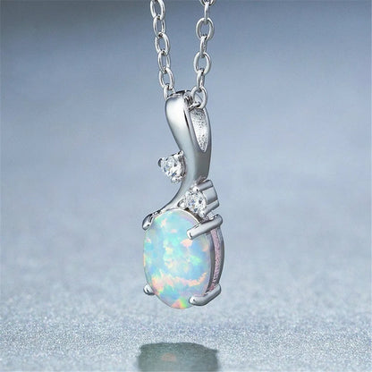 Water drop shaped opal pendant on an adjustable O-chain necklace in rose gold finish.