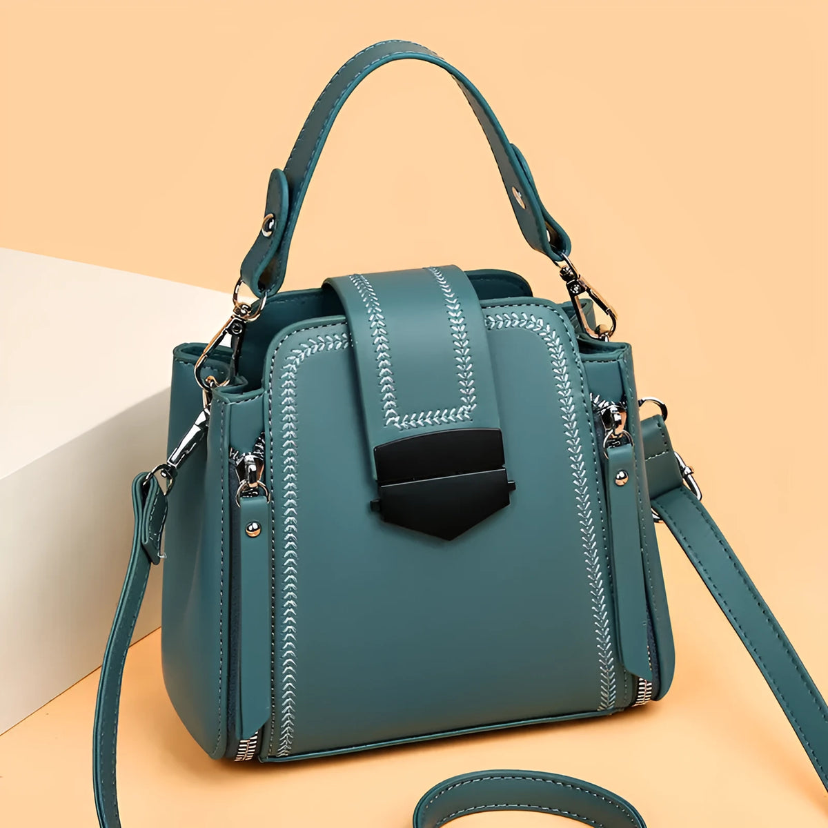 Soft PU leather ladies handbag with textured surface and sewing thread detailing in square vertical shape