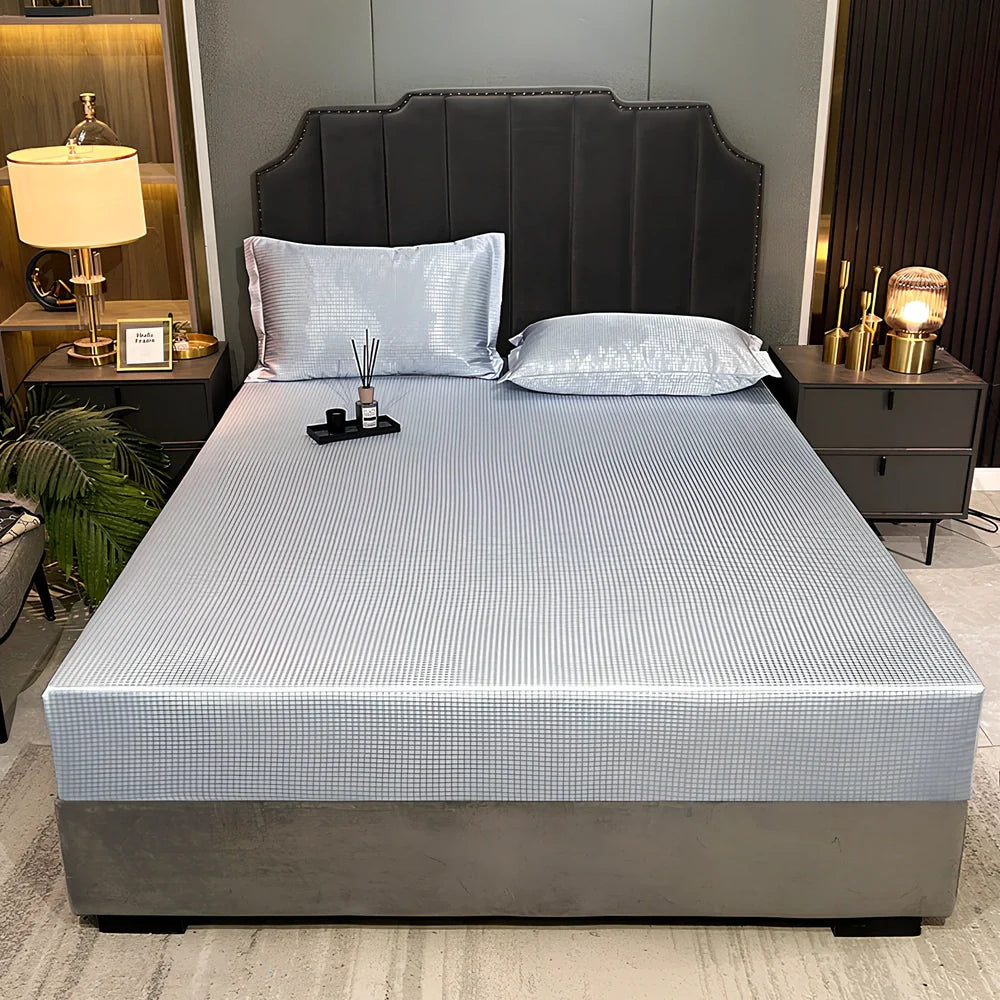 Houndstooth ice silk jacquard fitted three-piece bedding set in ice blue, 180x200cm size with pillowcases on white bed