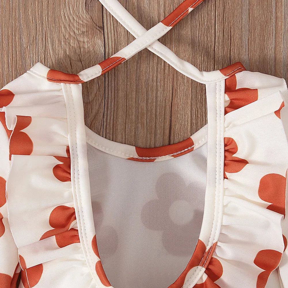 Girl's floral print swimsuit with crew neck and open back design in polyester fabric