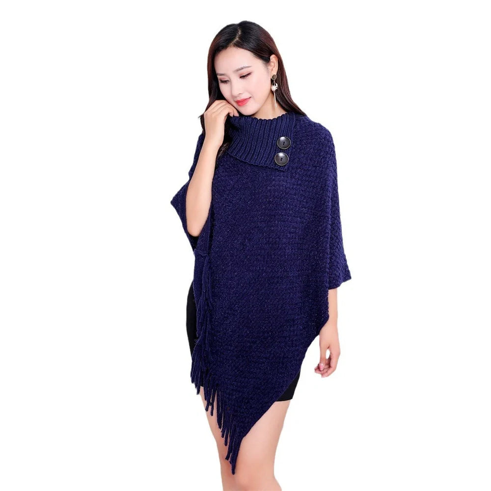 Sleeveless polka dot shawl in apricot colour draped over chair, showing 150cm length and acrylic fibre texture