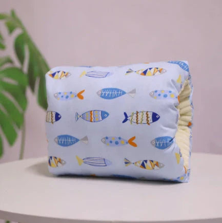 Adjustable cotton nursing pillow with various colorful designs, providing comfort and support for breastfeeding and bottle-feeding
