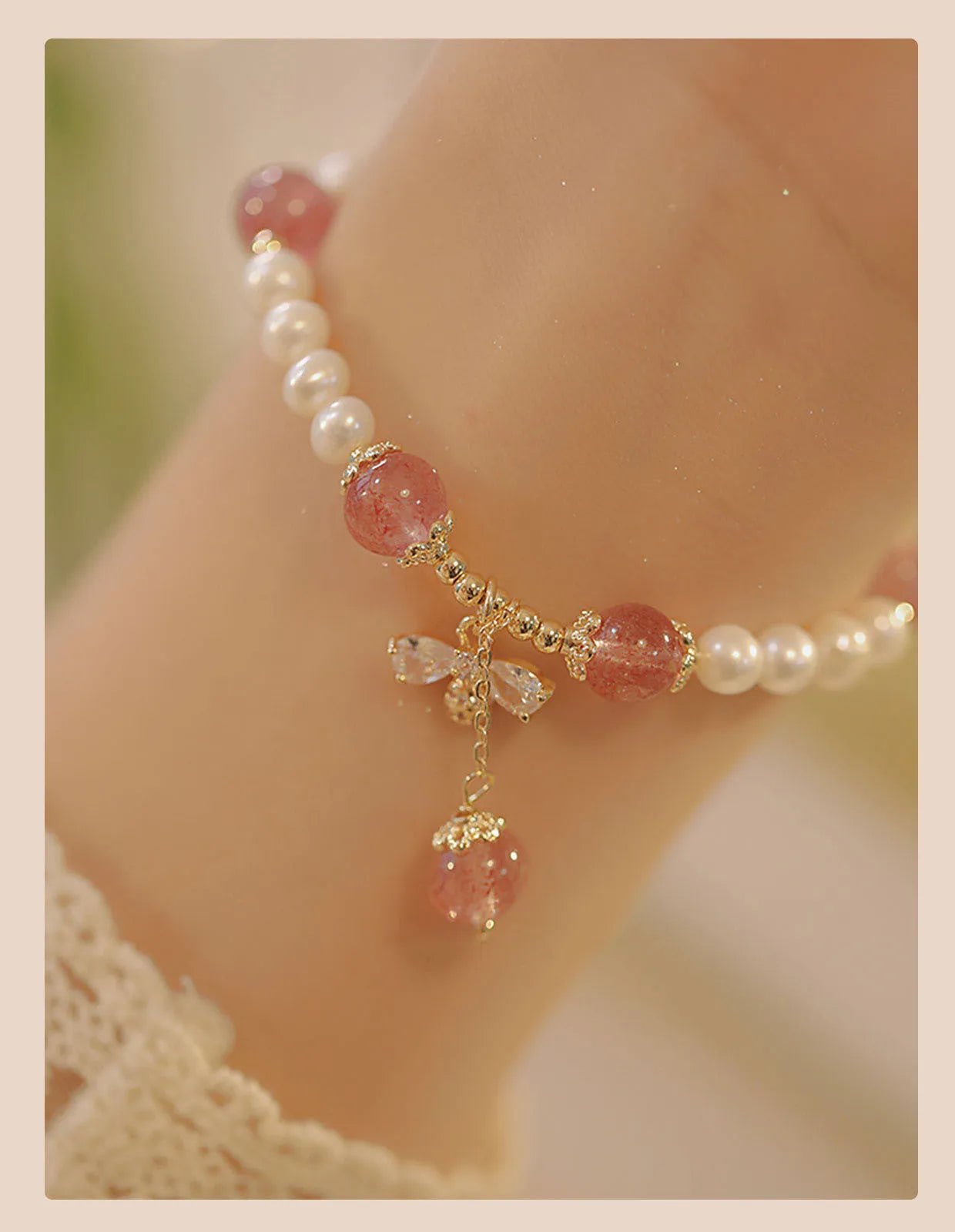 Women's adjustable Strawberry Quartz crystal bracelet with bow charm on wrist
