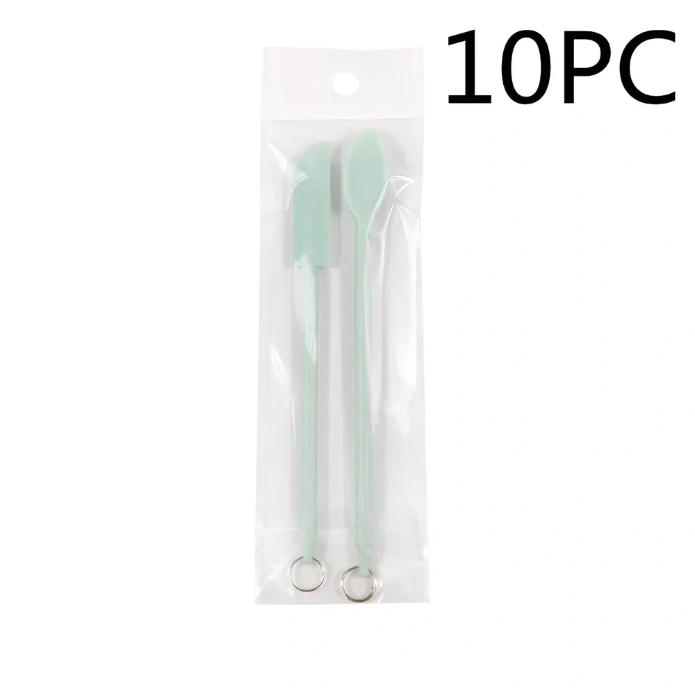 Retractable silicone cosmetic spatula extended to 15cm with scraper tool for product application
