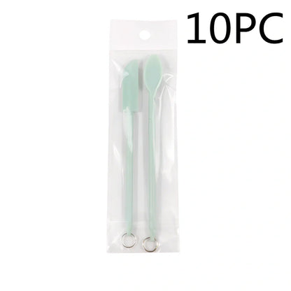 Retractable silicone cosmetic spatula extended to 15cm with scraper tool for product application