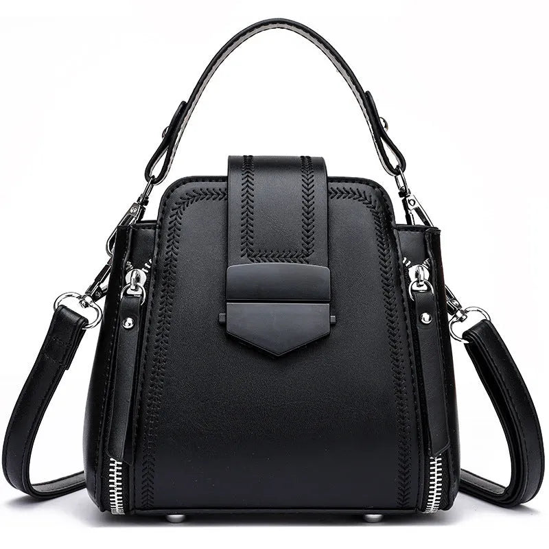 Soft PU leather ladies handbag with textured surface and sewing thread detailing in square vertical shape