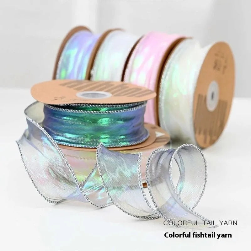 Fishtail yarn ribbon roll showing 4cm width and edge cutting detail in illusion colour options