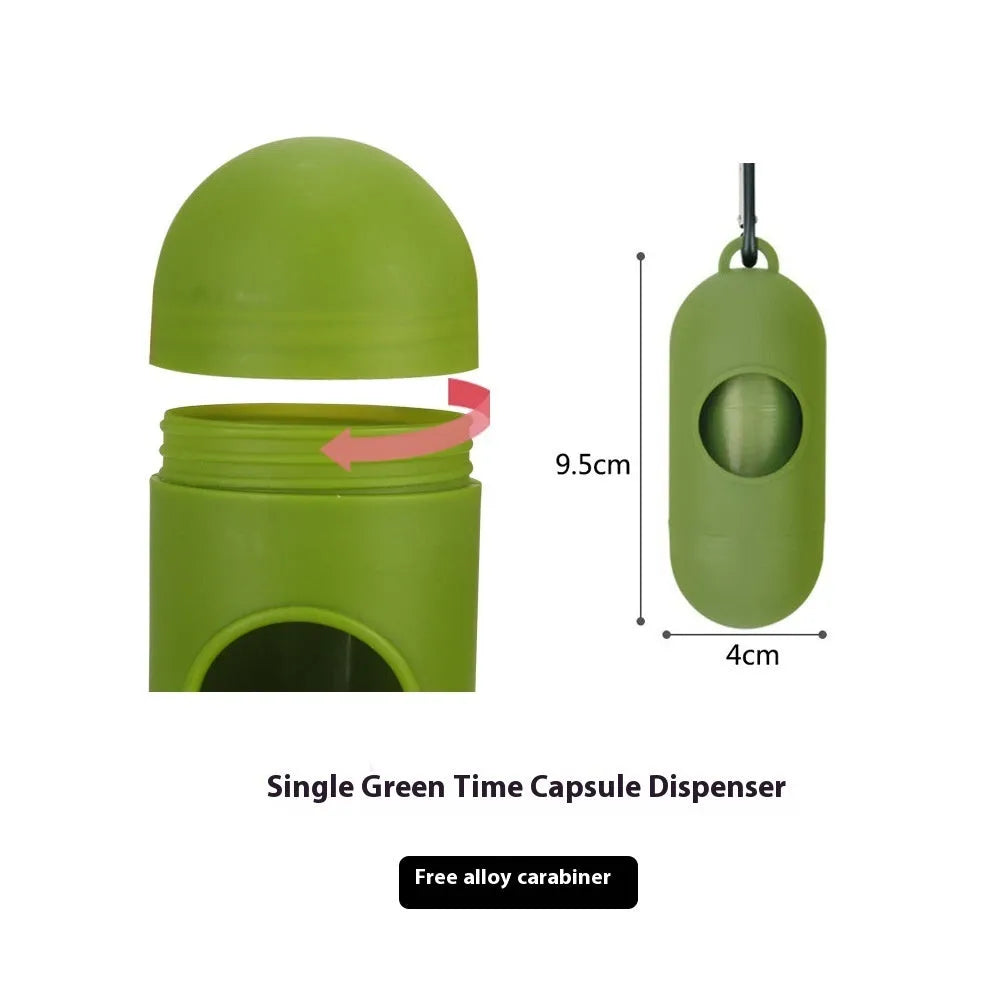 Roll of EPI green degradable pet waste bags next to a transparent dispenser on a grass background.