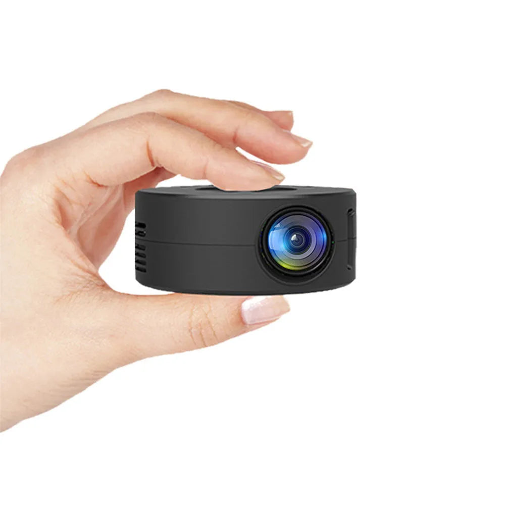 Black children's portable projector for mobile phones measuring 110x110x47mm with plug-in power cable