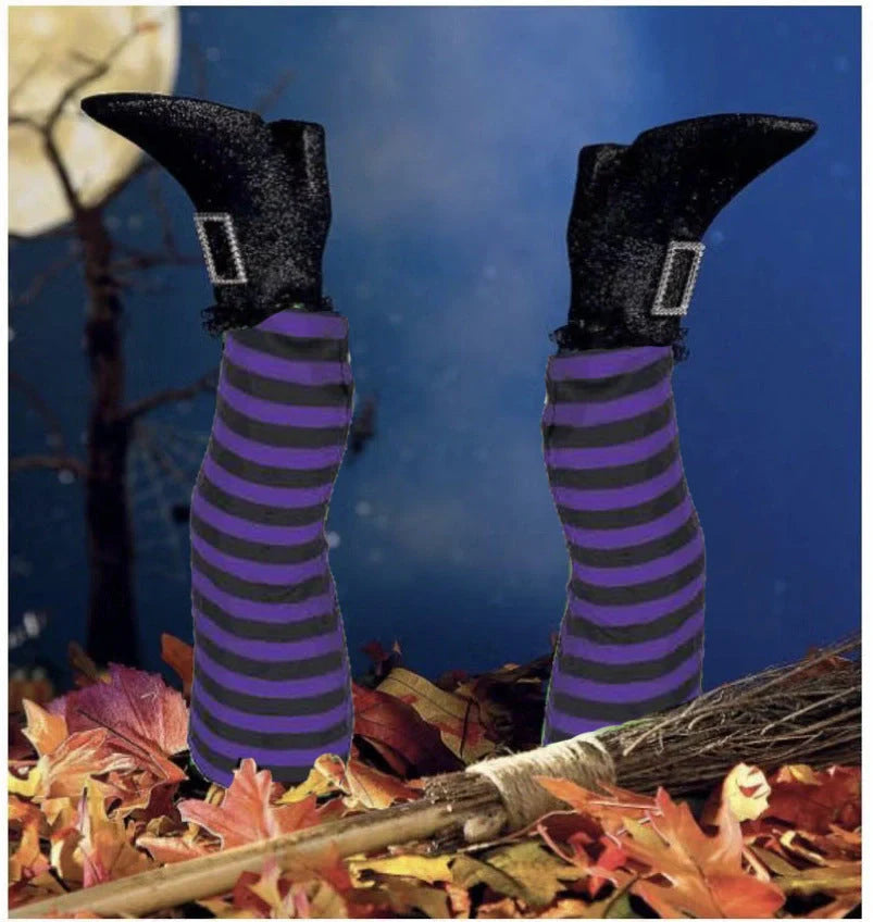 Halloween witch leg decoration with striped stockings and black boots
