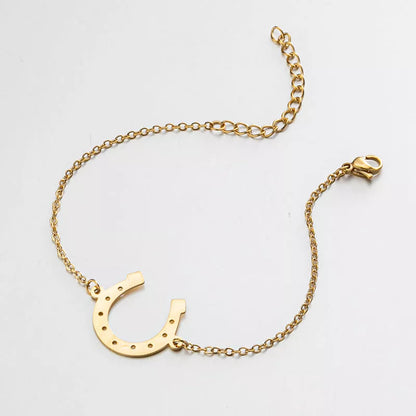 Punk Horse Shoe Chain Bracelet in gold and steel colors, featuring a unique U-shape charm