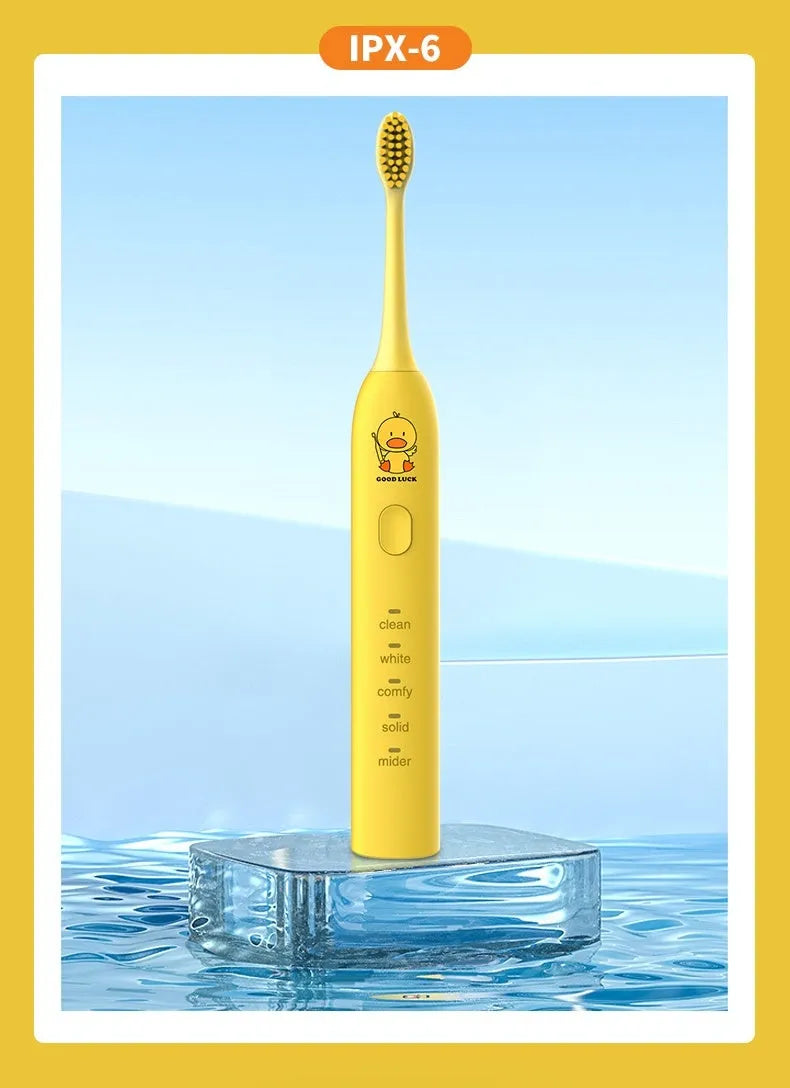 Yellow rechargeable electric toothbrush with small duck design, soft bristles and USB charging cable