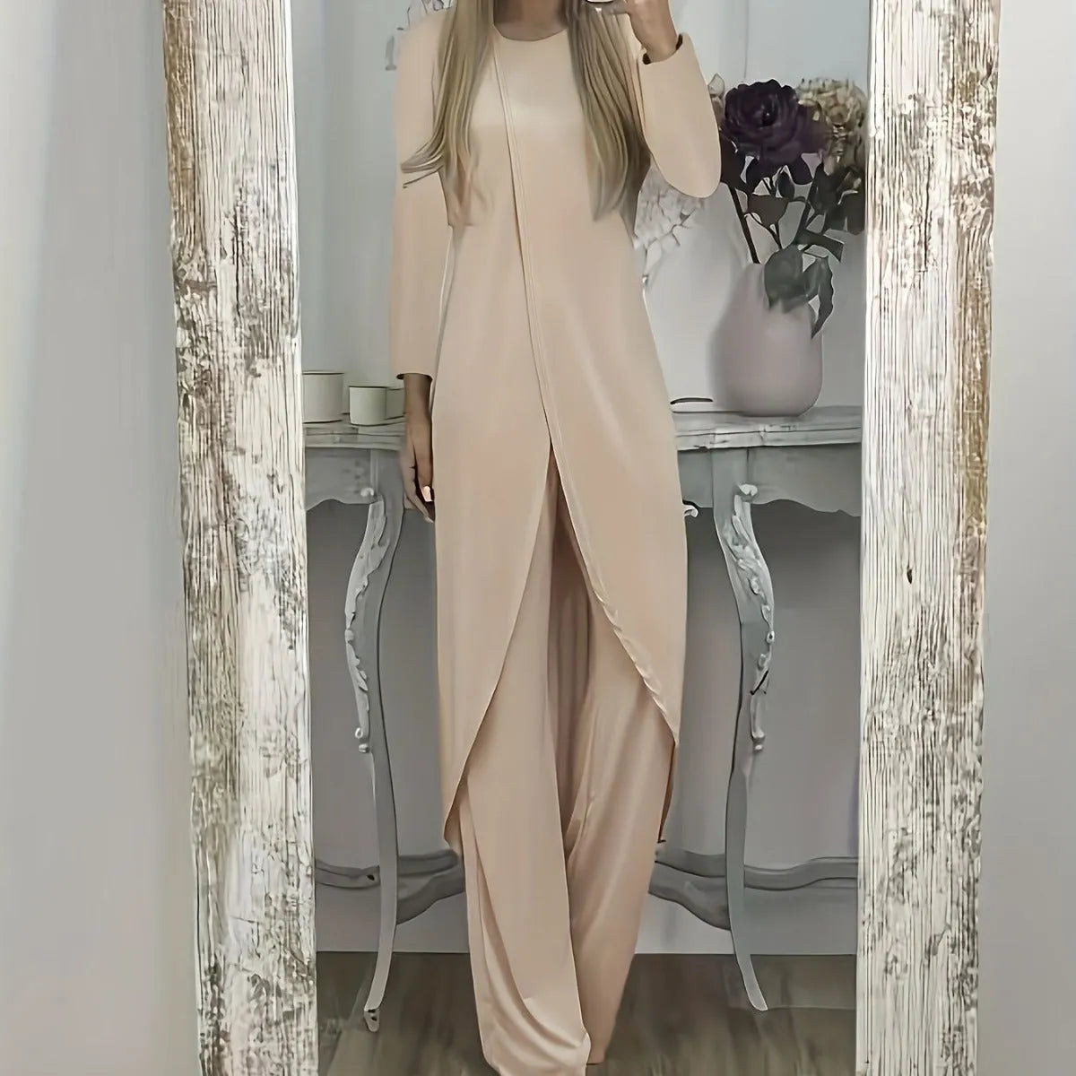Casual black polyester two-piece lounge set with long sleeves and loose fit trousers on a hanger.
