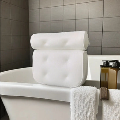 White bathtub pillow with 7 suction cups and 4D mesh design, measuring 37x34x10cm, on a bathtub