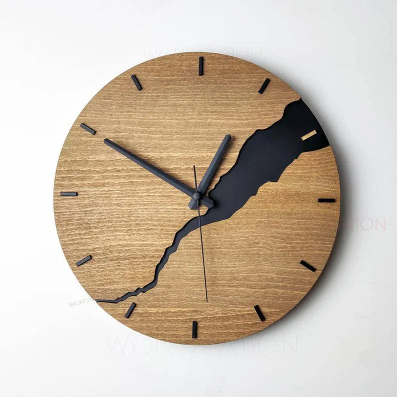 Modern wooden wall clock with crack finish surface in circular design showing time markers