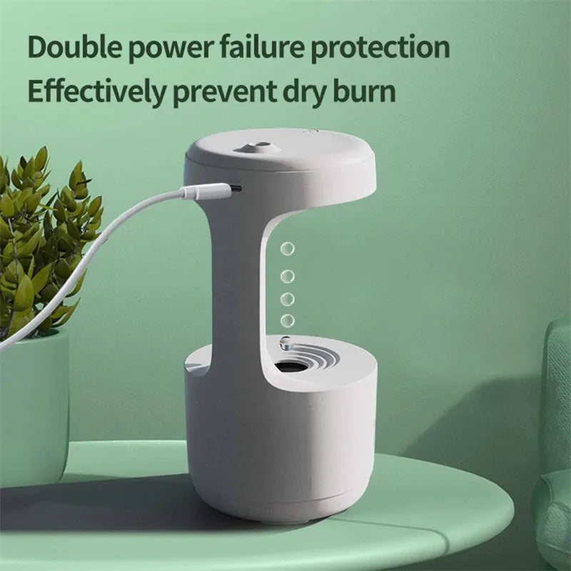 White columnar anti-gravity humidifier with LED clock display on a wooden desk