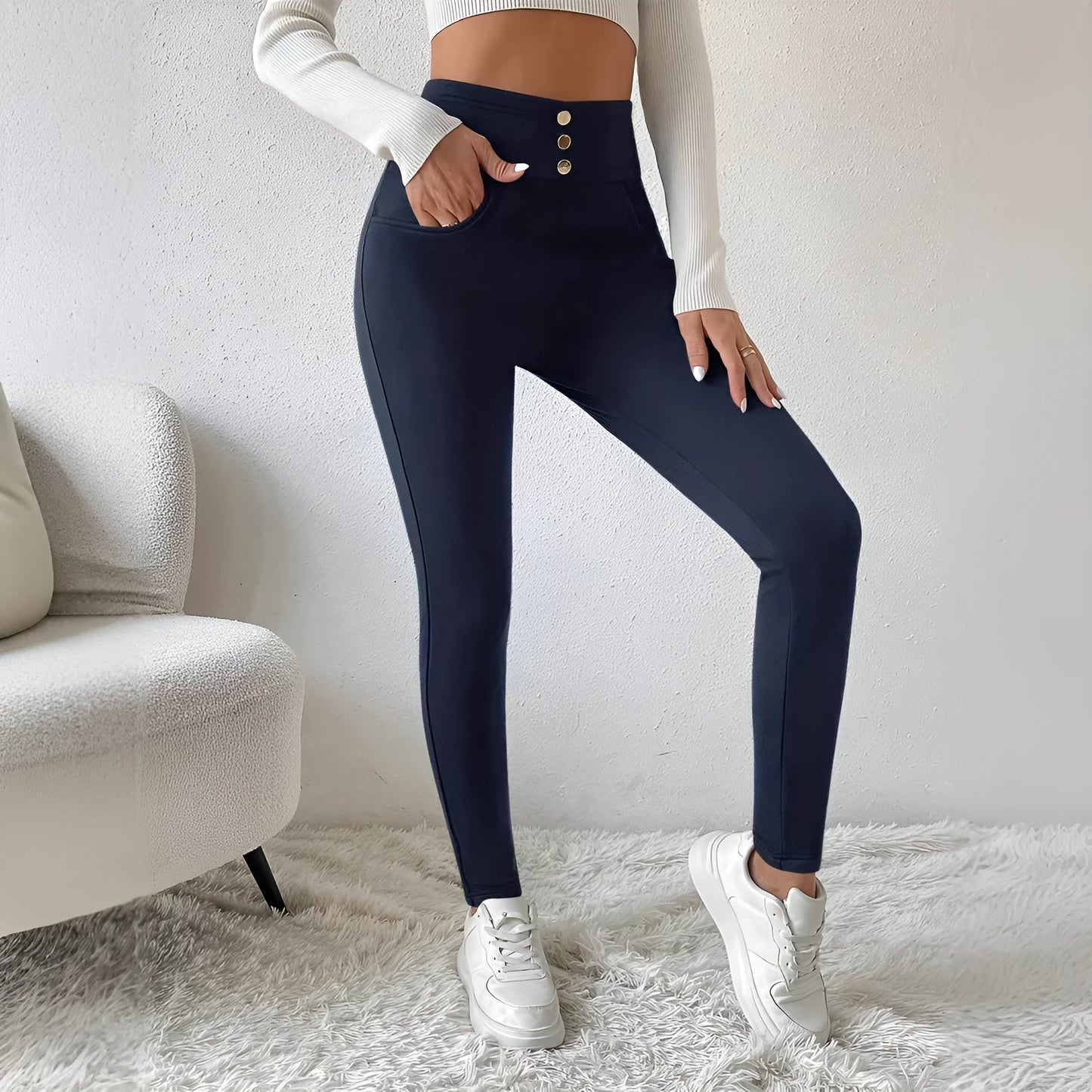 Navy blue women's high-waist slim-fit casual trousers on a hanger