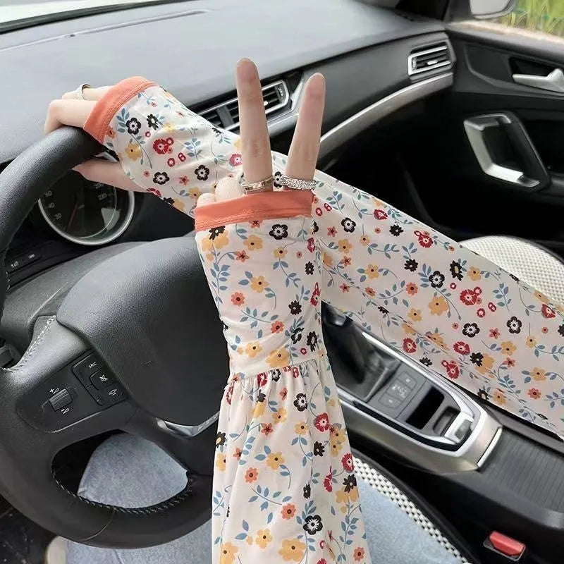 UV protection ice silk oversleeves in floral pattern covering forearm and elbow