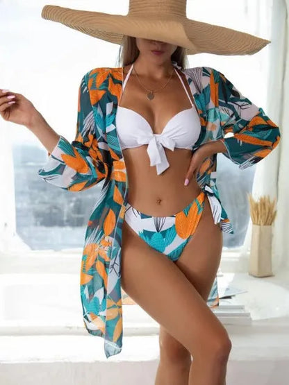 Women's three-piece bikini swimsuit set in polyester with mesh split design.