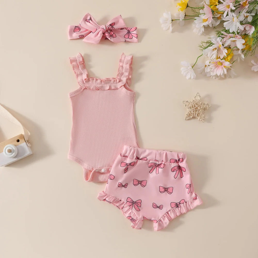 Girls' pink cotton romper and shorts two-piece set with included hair accessory