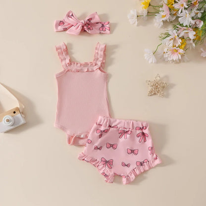 Girls' pink cotton romper and shorts two-piece set with included hair accessory
