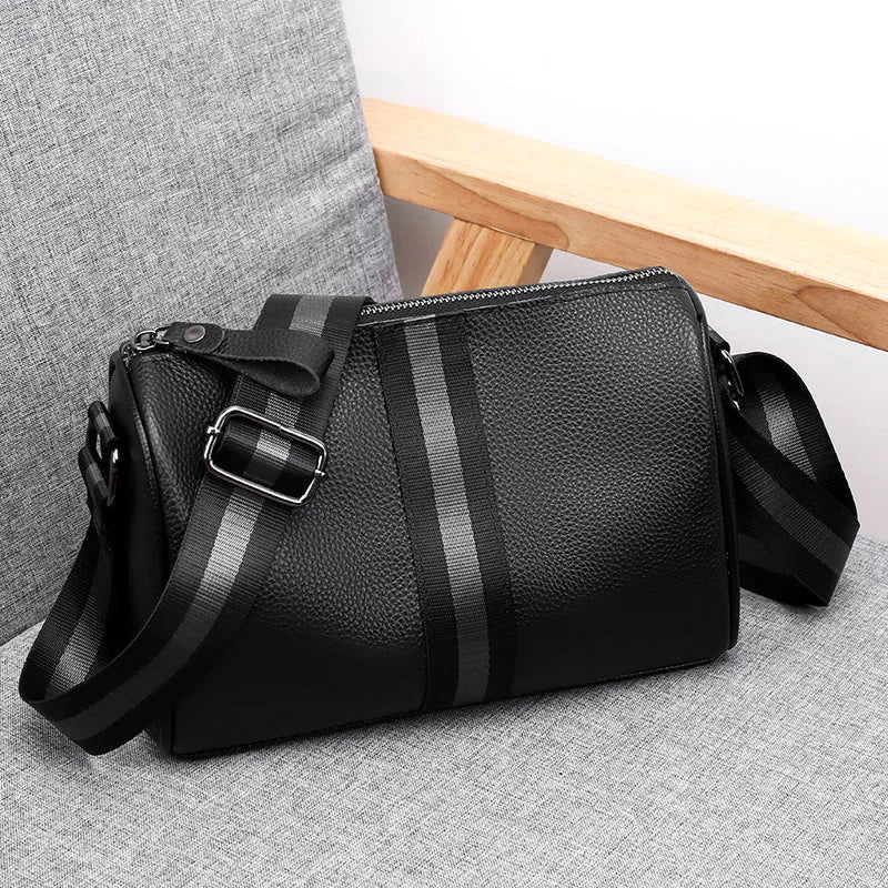 Black genuine leather one-shoulder crossbody bag with dimensions 24cm wide by 16cm high.