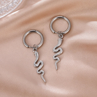 Gold coloured snake-shaped vintage clip-on earrings made from stainless steel.