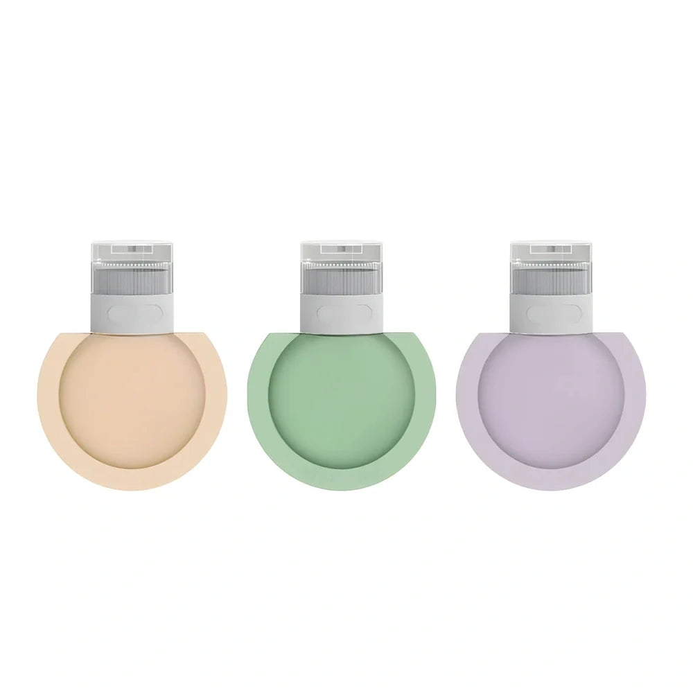 Three silicone travel bottles in different colours with stickers, showing 60ml and 90ml sizes for shampoo and cosmetics