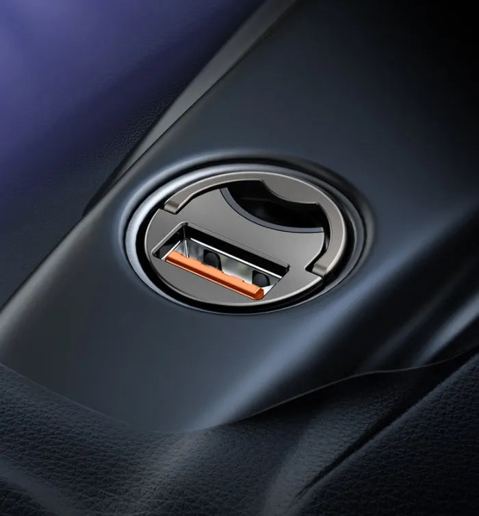 Baseus grey mini car charger with 1-metre cable plugged into vehicle 12V socket