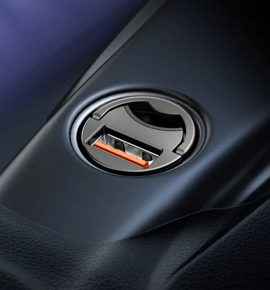Baseus grey mini car charger with 1-metre cable plugged into vehicle 12V socket