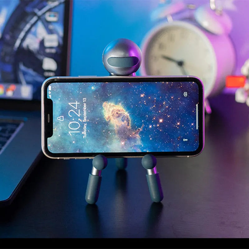 Aluminium alloy desktop phone and tablet stand with 120-degree adjustable angle, alien shape, green and pink options.