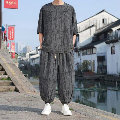 Men's black and grey knitted short-sleeve top with matching loose cropped trousers casual suit set