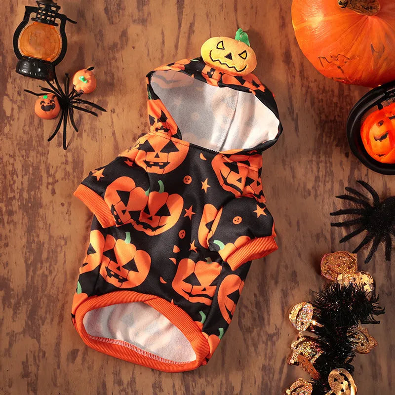 Halloween pet costume: orange pumpkin skirt and black Halloween sweater for small dogs and cats on a mannequin.
