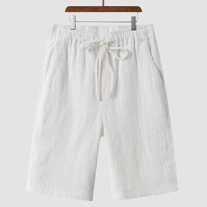 Men's linen casual shorts with elastic waistband in loose cropped design showing beige colour option